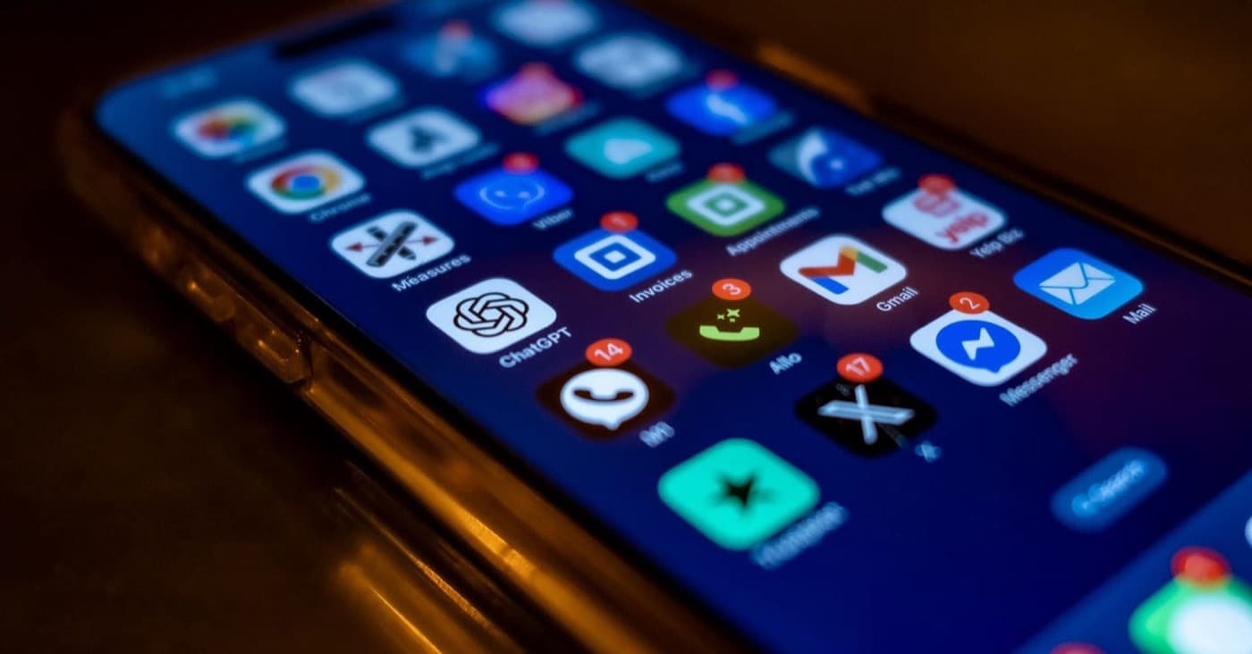 A phone screen crowded with messaging apps, all showing unread notification badges